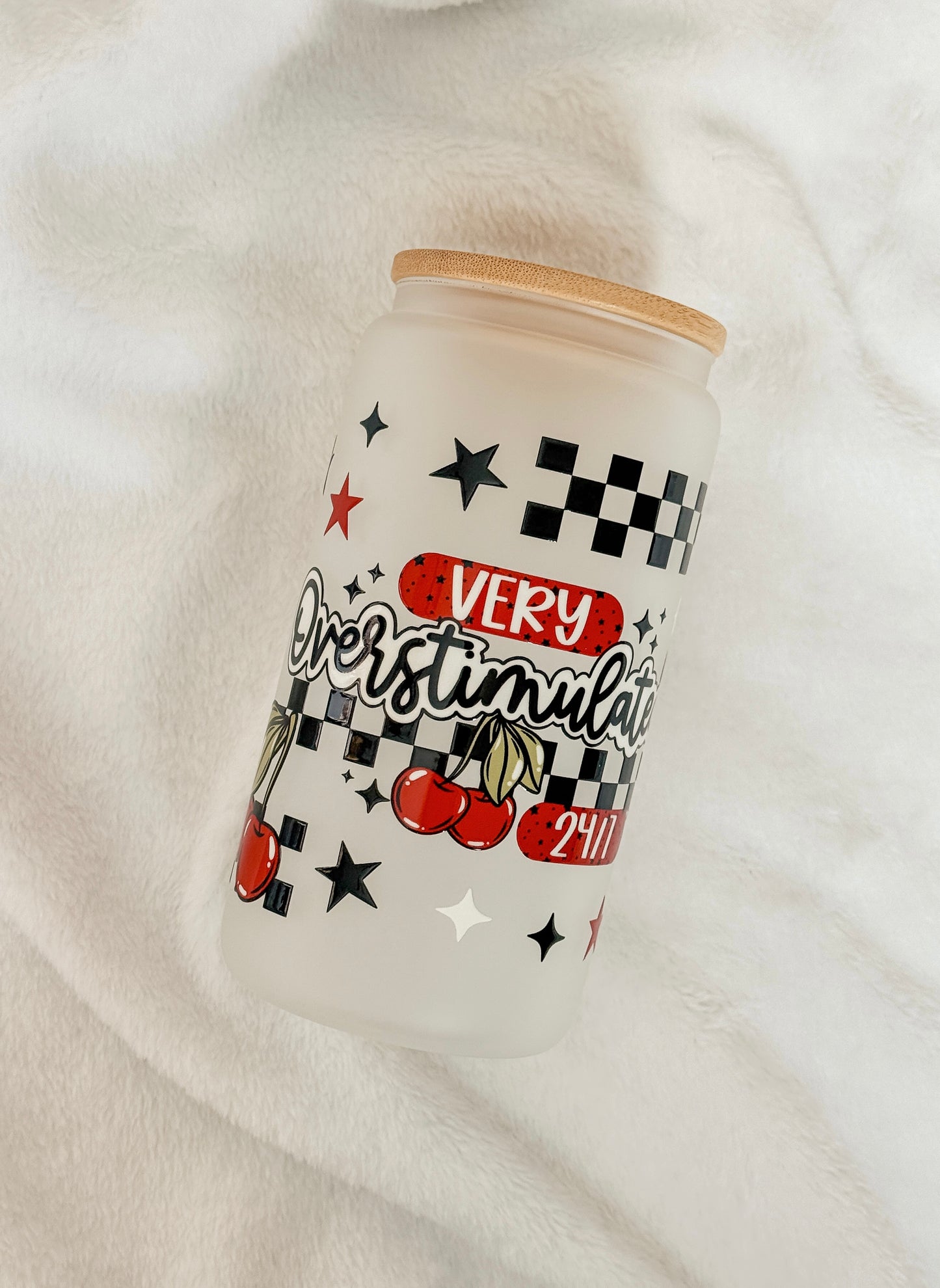 Tumbler with retro decorative design and text on a white background