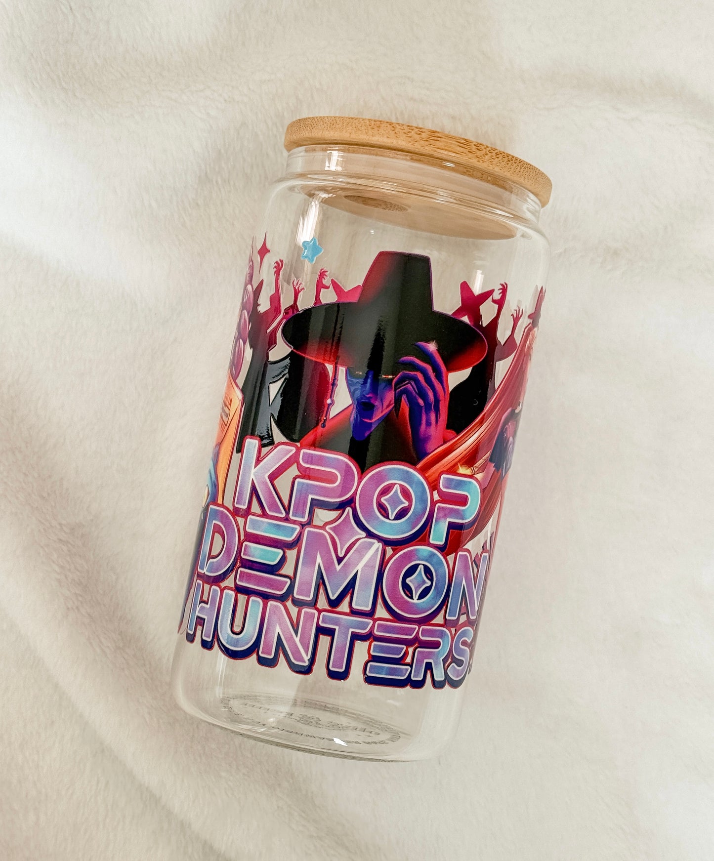 Glass jar with wooden lid featuring 'KPOP DEMON HUNTERS' design on a white background