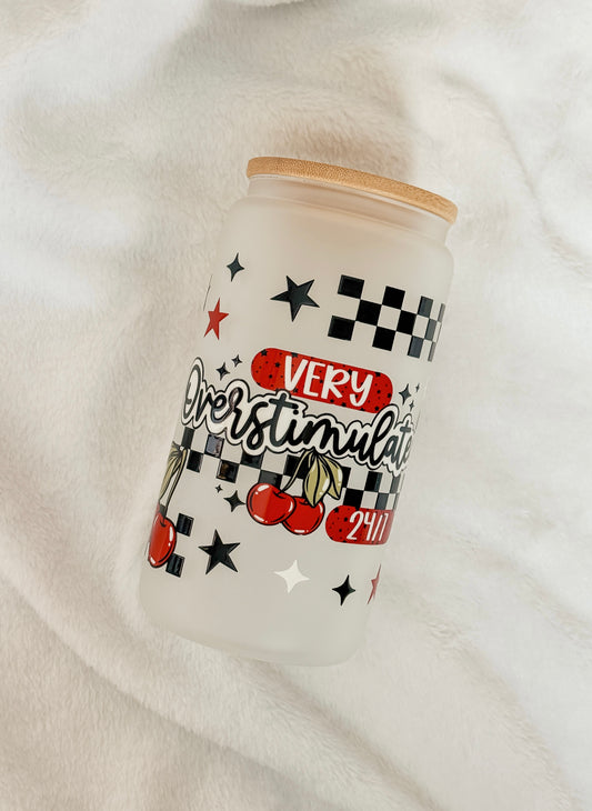 Tumbler with retro decorative design and text on a white background